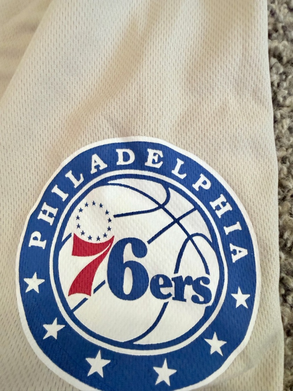 NBA Logo Tag Tee in Beige with Red and Blue Logo